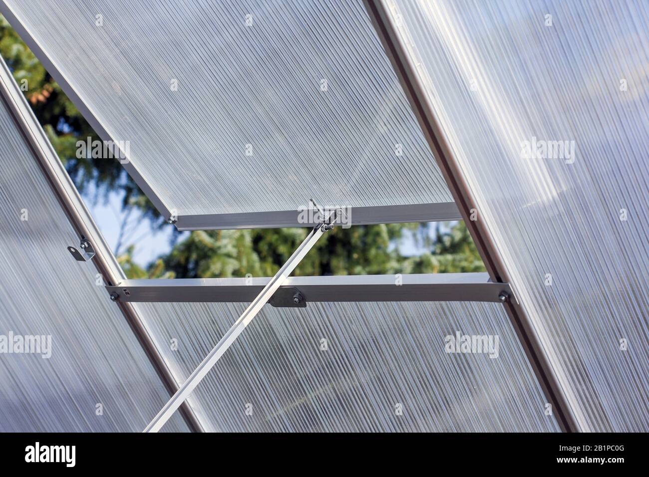 Greenhouse with open window for fresh air supply Stock Photo