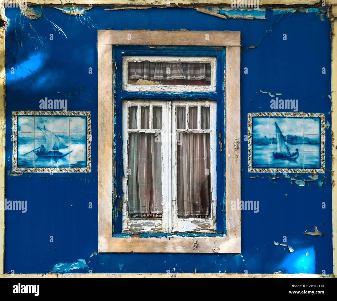 Lisbon. Old window with beautiful tile pictures. PANTONE CLASSIC BLUE 19-4052 Stock Photo