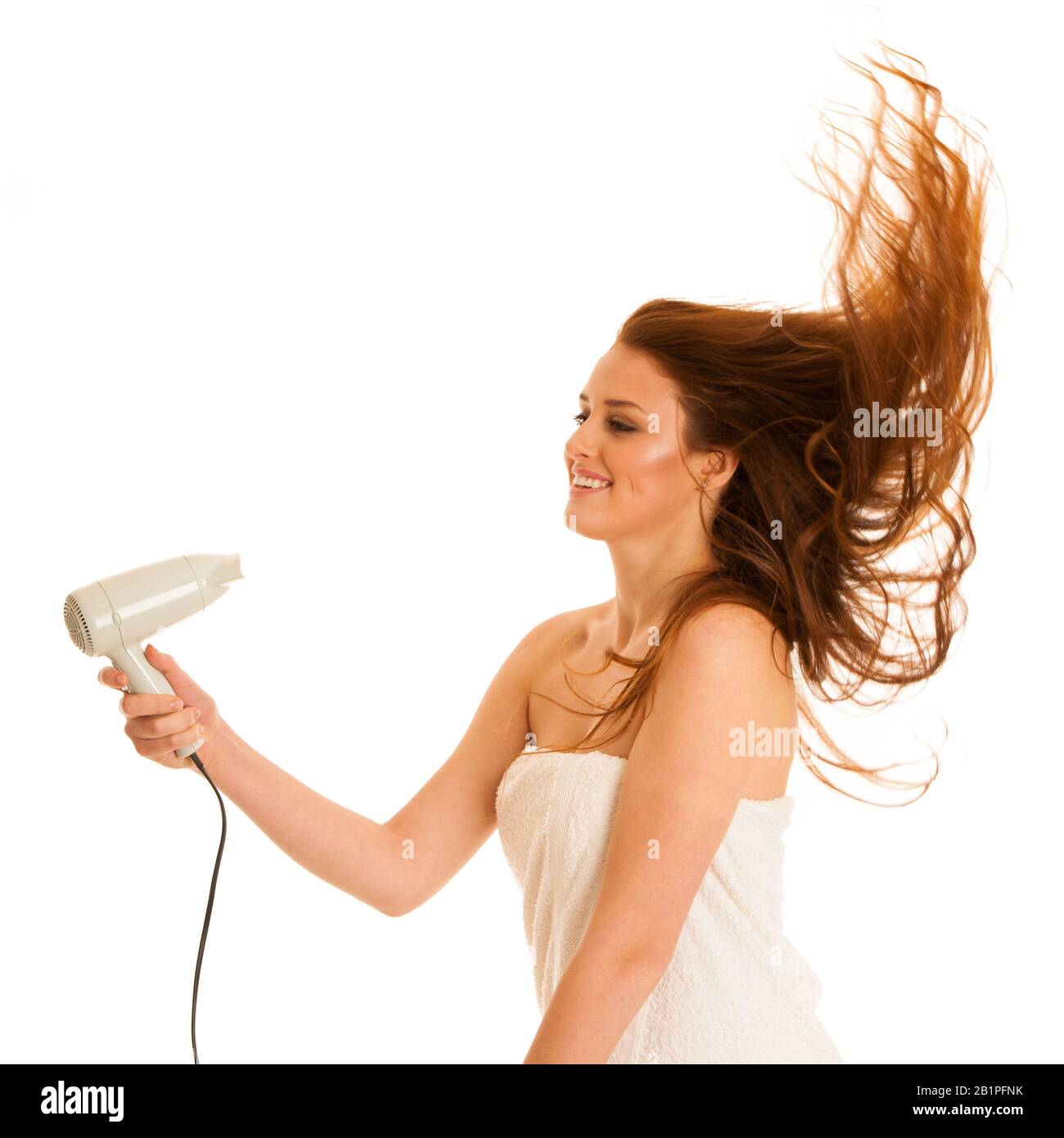beautiful young woman dries hair with a blow dryer Stock Photo - Alamy
