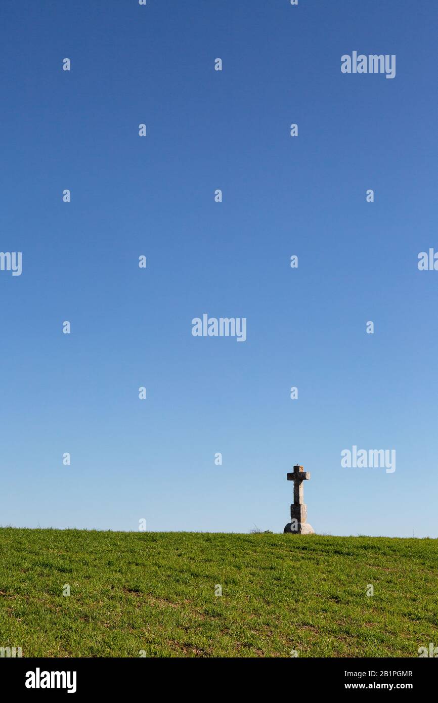 Stone cross on the crest of a hill in Andalusia, Spain Stock Photo