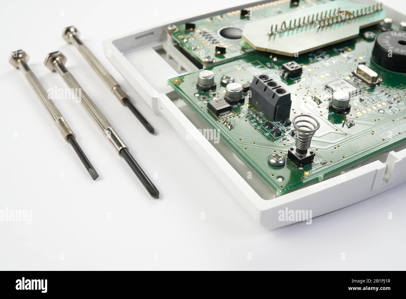 Home alarm control panel repairing. Open Electronic board panel with