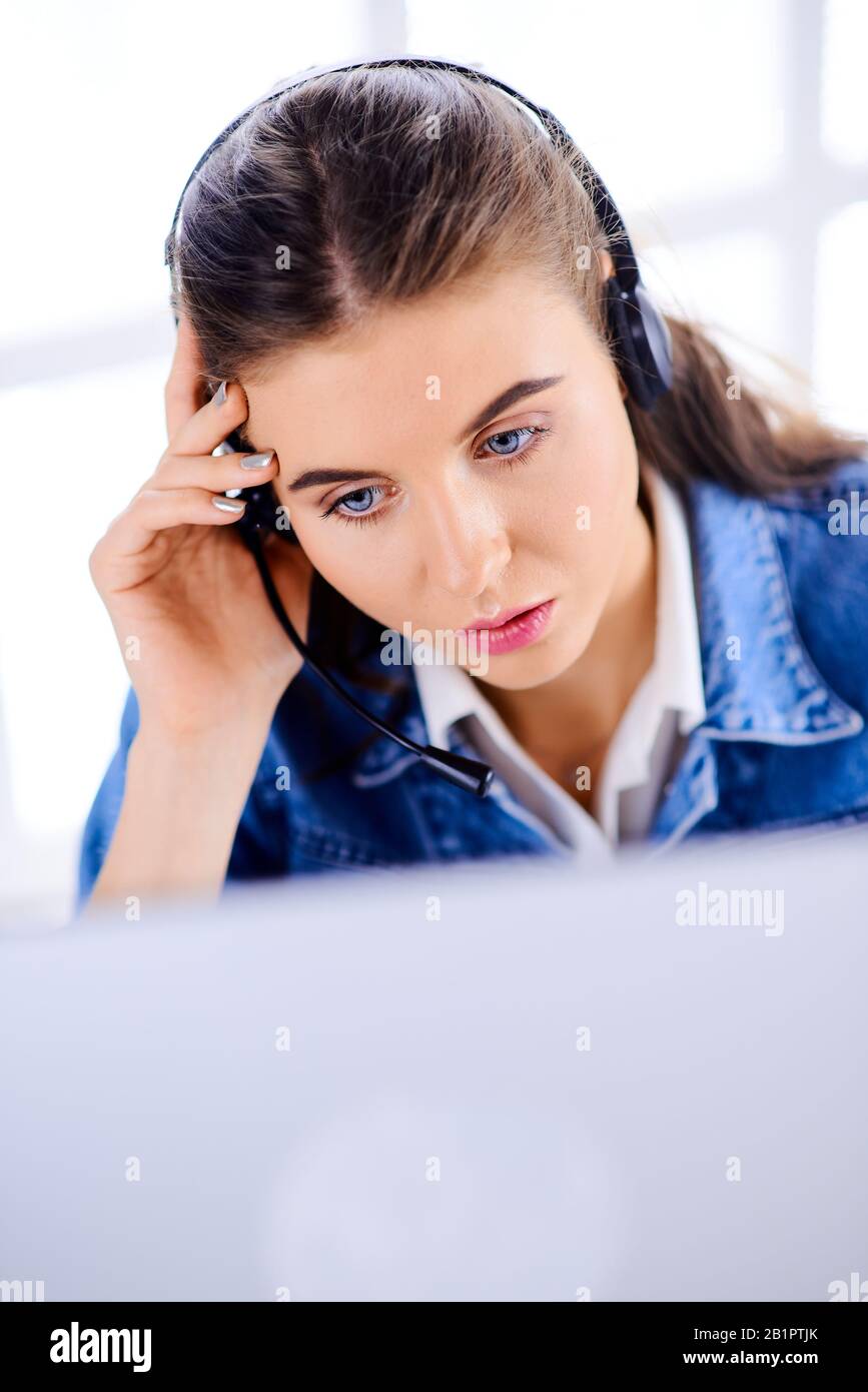 Young call center female agent browsing the internet on her computer Stock  Photo - Alamy