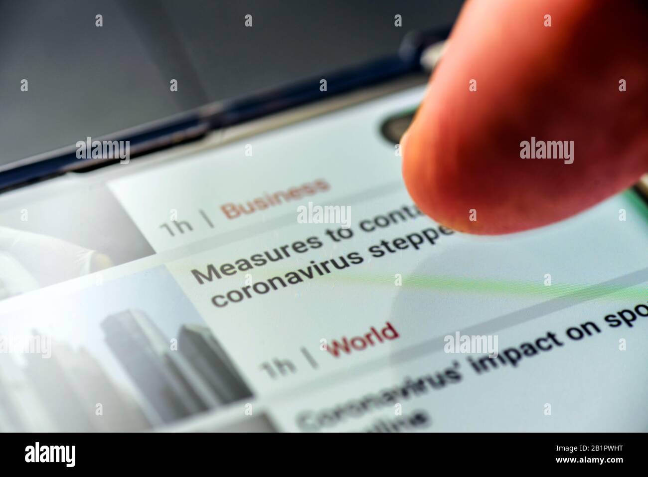 coronavirus measures text on smart phone screen - Northampton, UK - February 25, 2020 Stock Photo