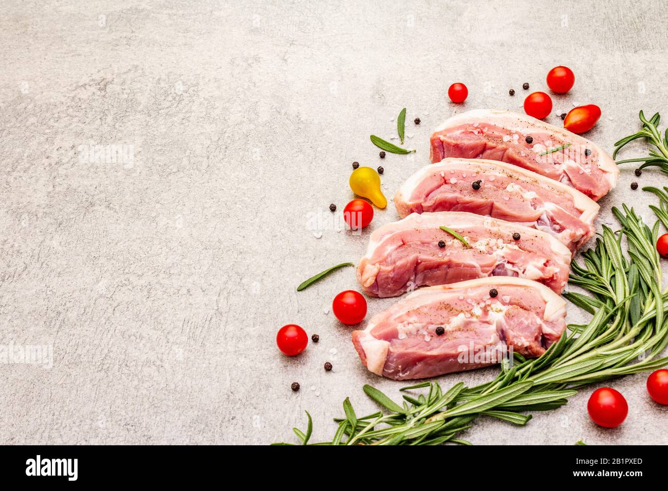 Raw pork belly with rind, peritoneum meat. Fresh tomato cherry