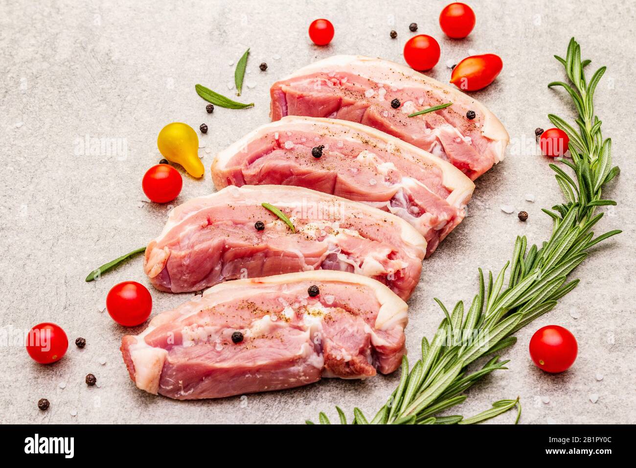 Raw pork belly with rind, peritoneum meat. Fresh tomato cherry