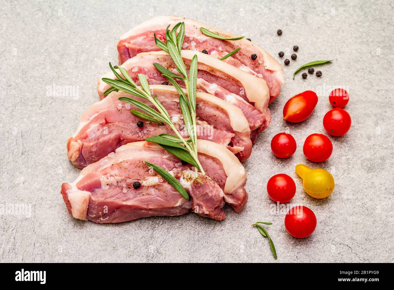 Raw pork belly with rind, peritoneum meat. Fresh tomato cherry