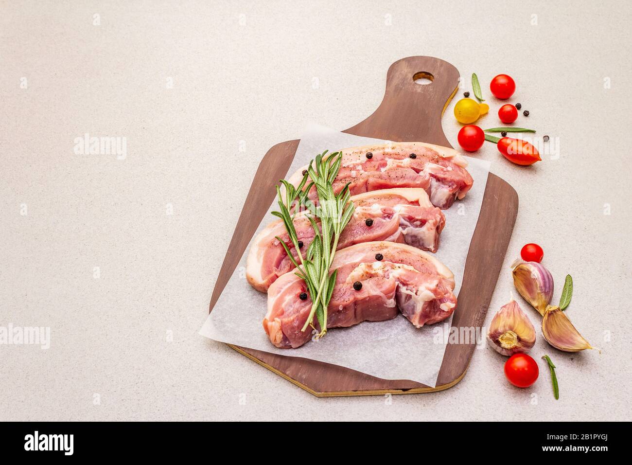 Raw pork belly with rind, peritoneum meat. Fresh tomato cherry