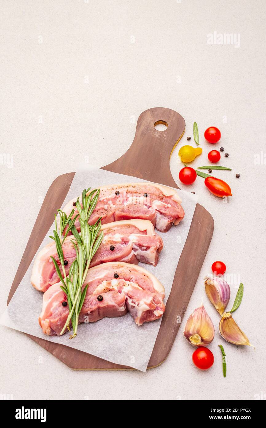Raw pork belly with rind, peritoneum meat. Fresh tomato cherry