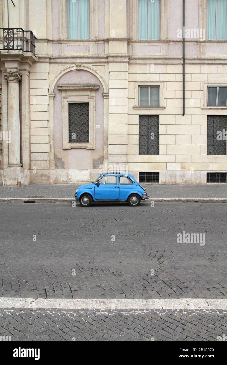 ROME - MAY 12: Fiat 500 parked on May 12, 2010 in Rome, Italy. With almost 4 million units sold, Fiat 500 is among Top 50 cars in automotive history. Stock Photo