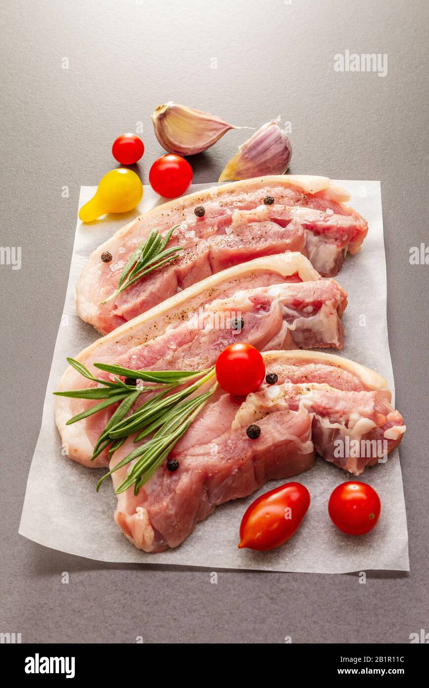 Raw pork belly with rind, peritoneum meat. Fresh tomato cherry