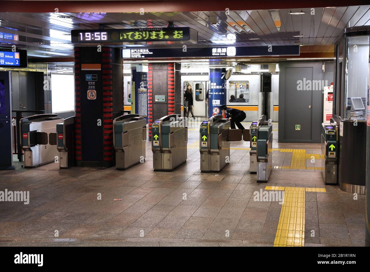 TOKYO, JAPAN - APRIL 13, 2012: People enter Tokyo Metro. With more than 3.1 billion annual passenger rides, Tokyo subway system is the busiest worldwi Stock Photo