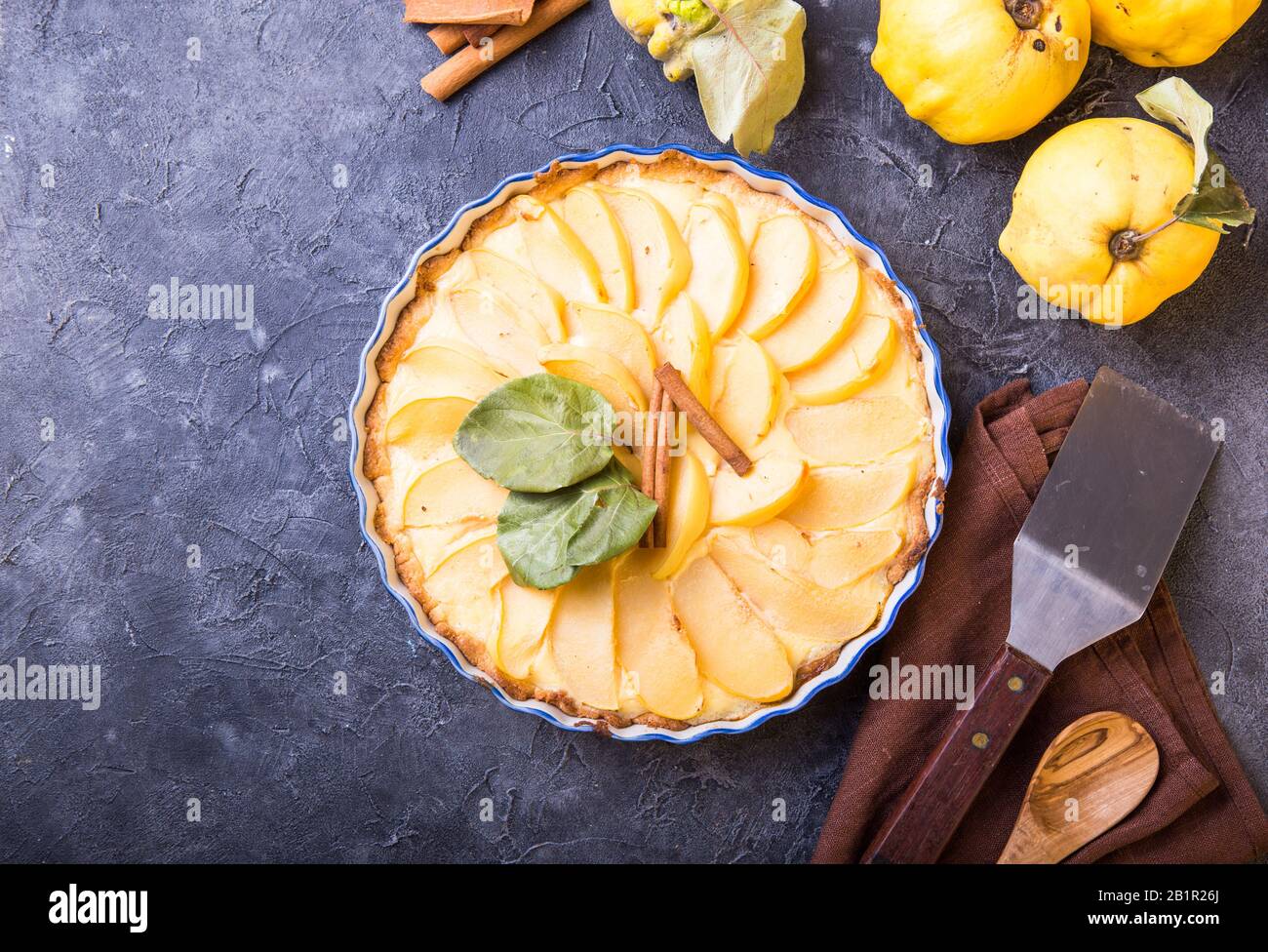 quince tart with custard open and shortcrust pastry and cinnamon. Stock Photo