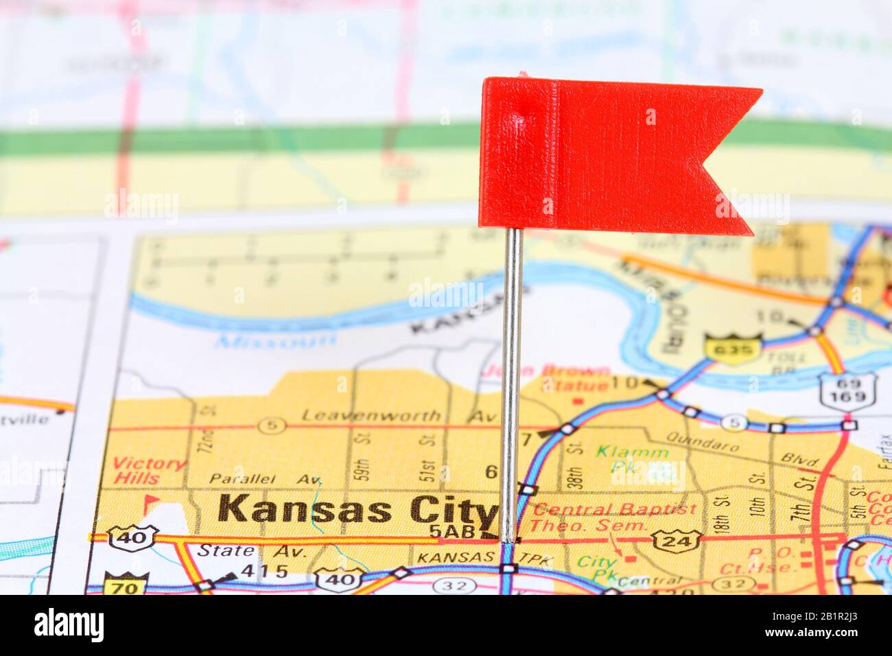 Kansas City, Missouri. Red flag pin on an old map showing travel