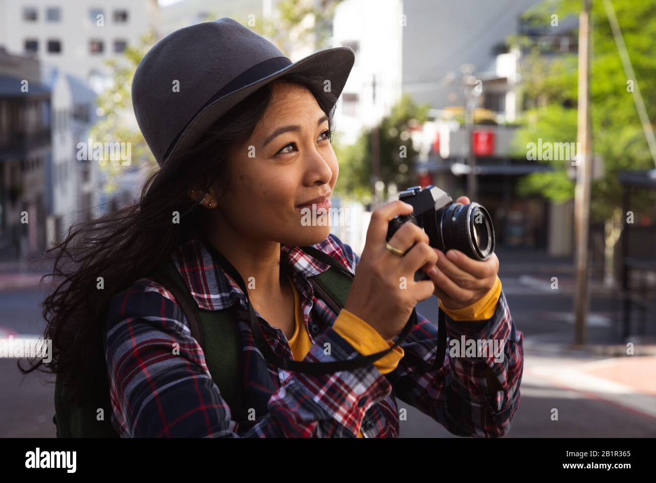 Woman taking picture on the street Stock Photo