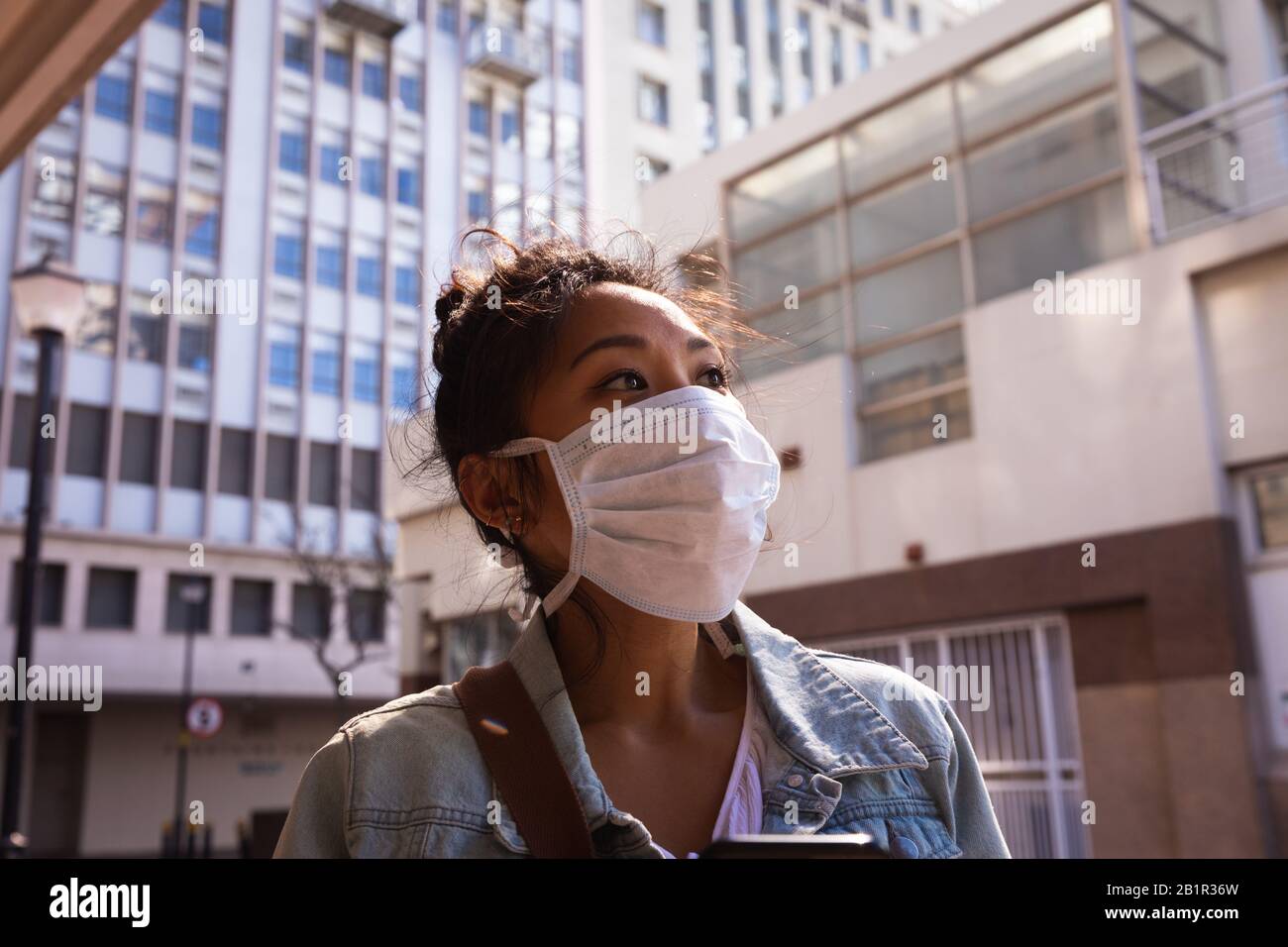Woman wearing a Corona Virus face mask Stock Photo