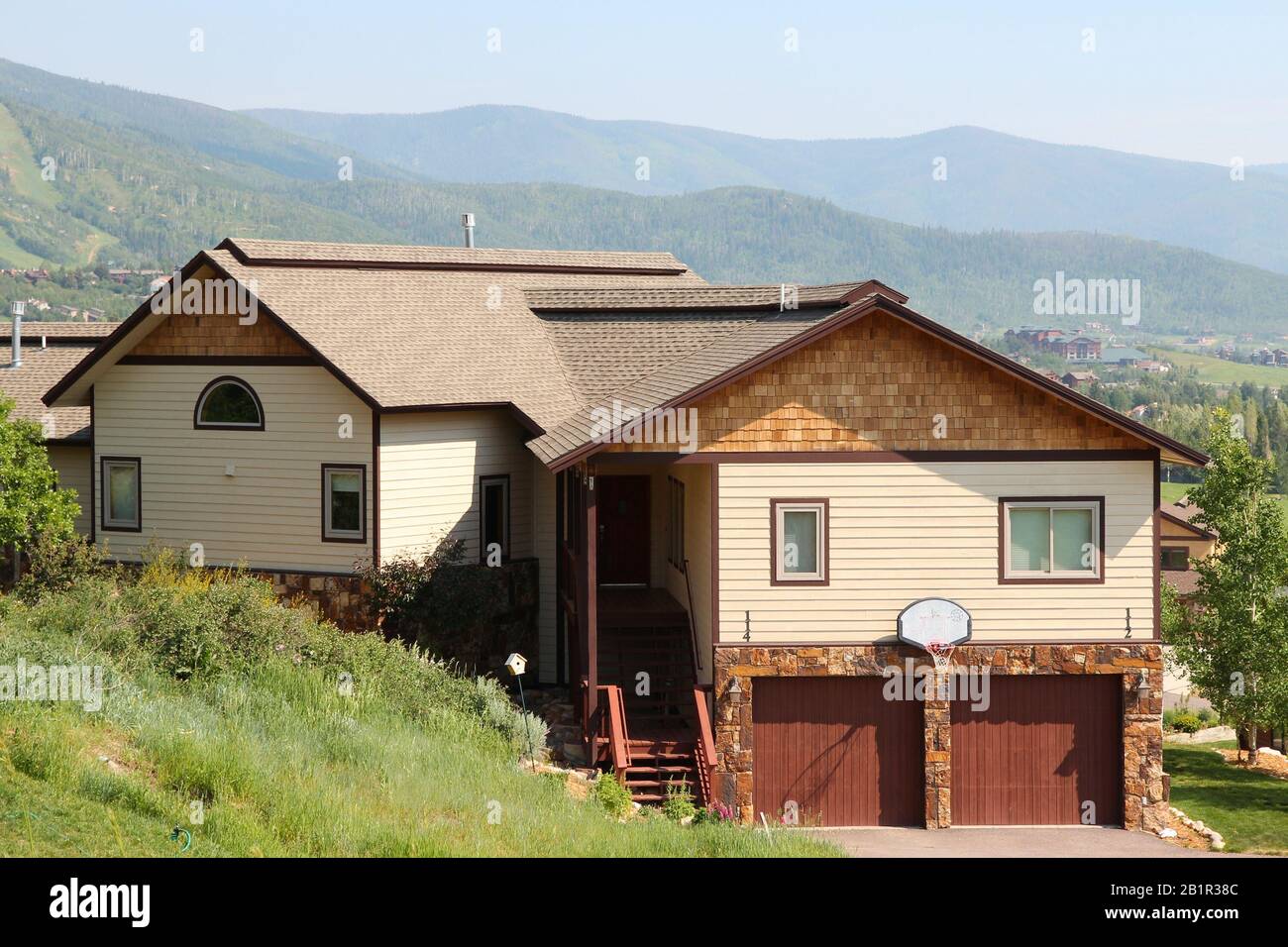 STEAMBOAT SPRINGS, COLORADO - JUNE 19, 2013: Generic house seen from public road in Steamboat Springs, Colorado. Over 5 million homes are sold annuall Stock Photo