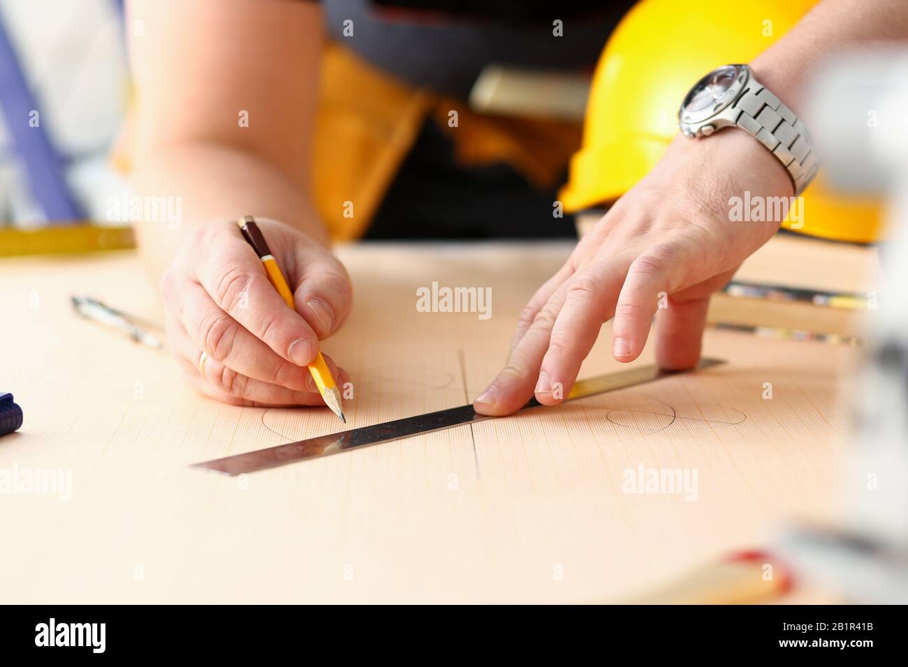 Arms of worker making structure plan Stock Photo Alamy