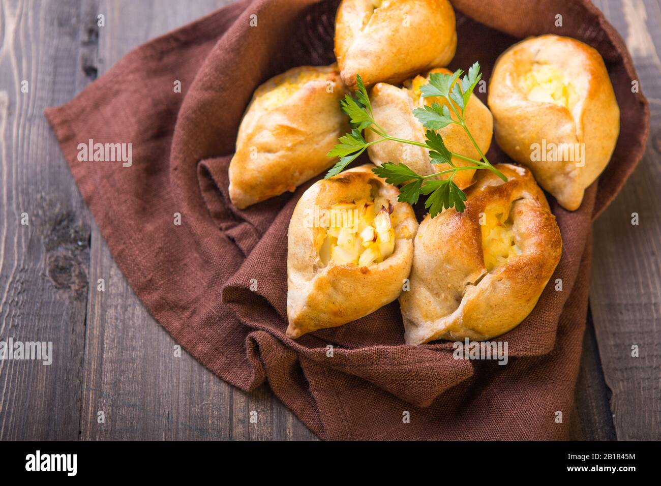Rasstegai pie with fish filling and rice , egg. Traditional meal of ...