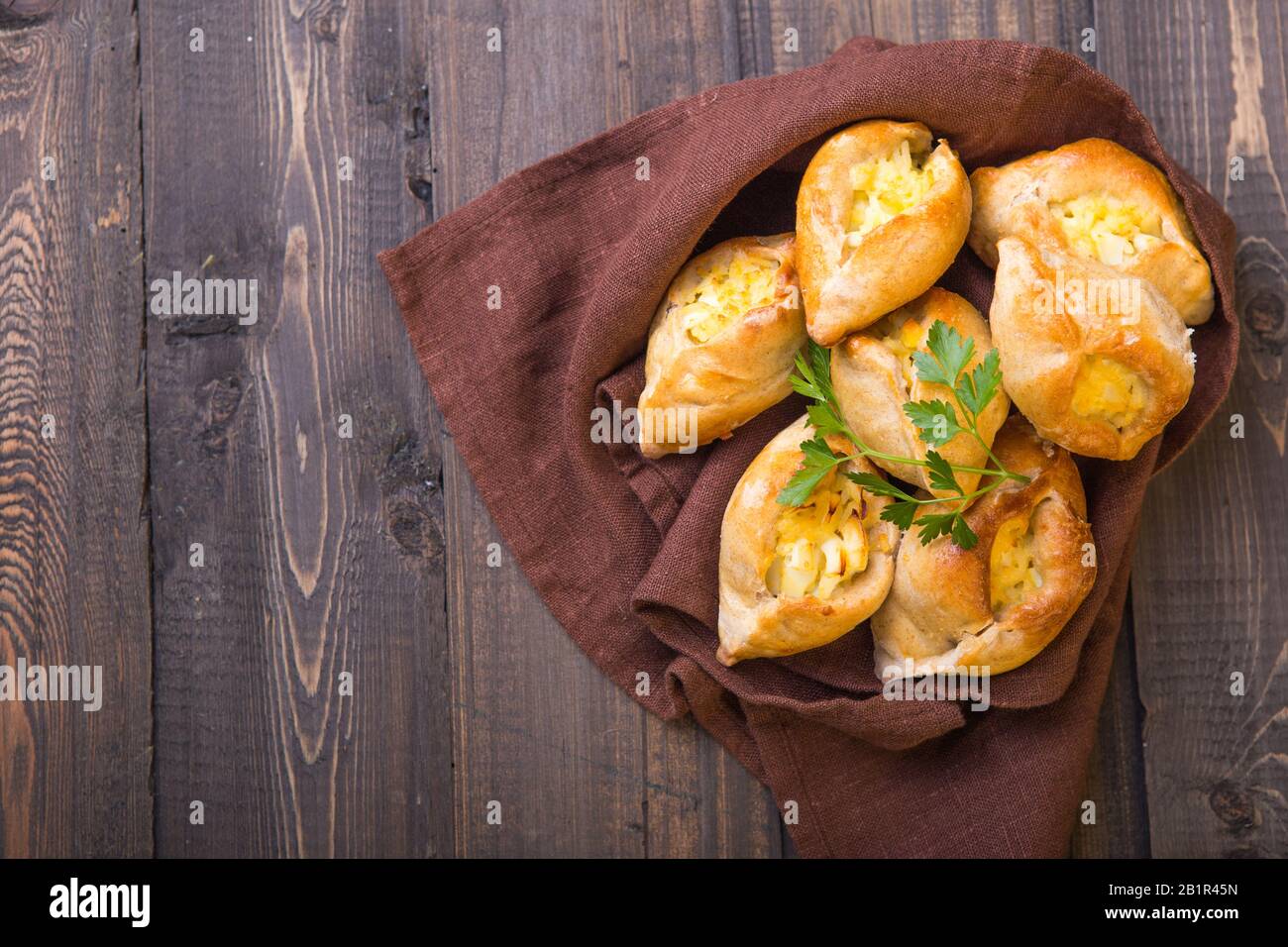 Rasstegai pie with fish filling and rice , egg. Traditional meal of ...