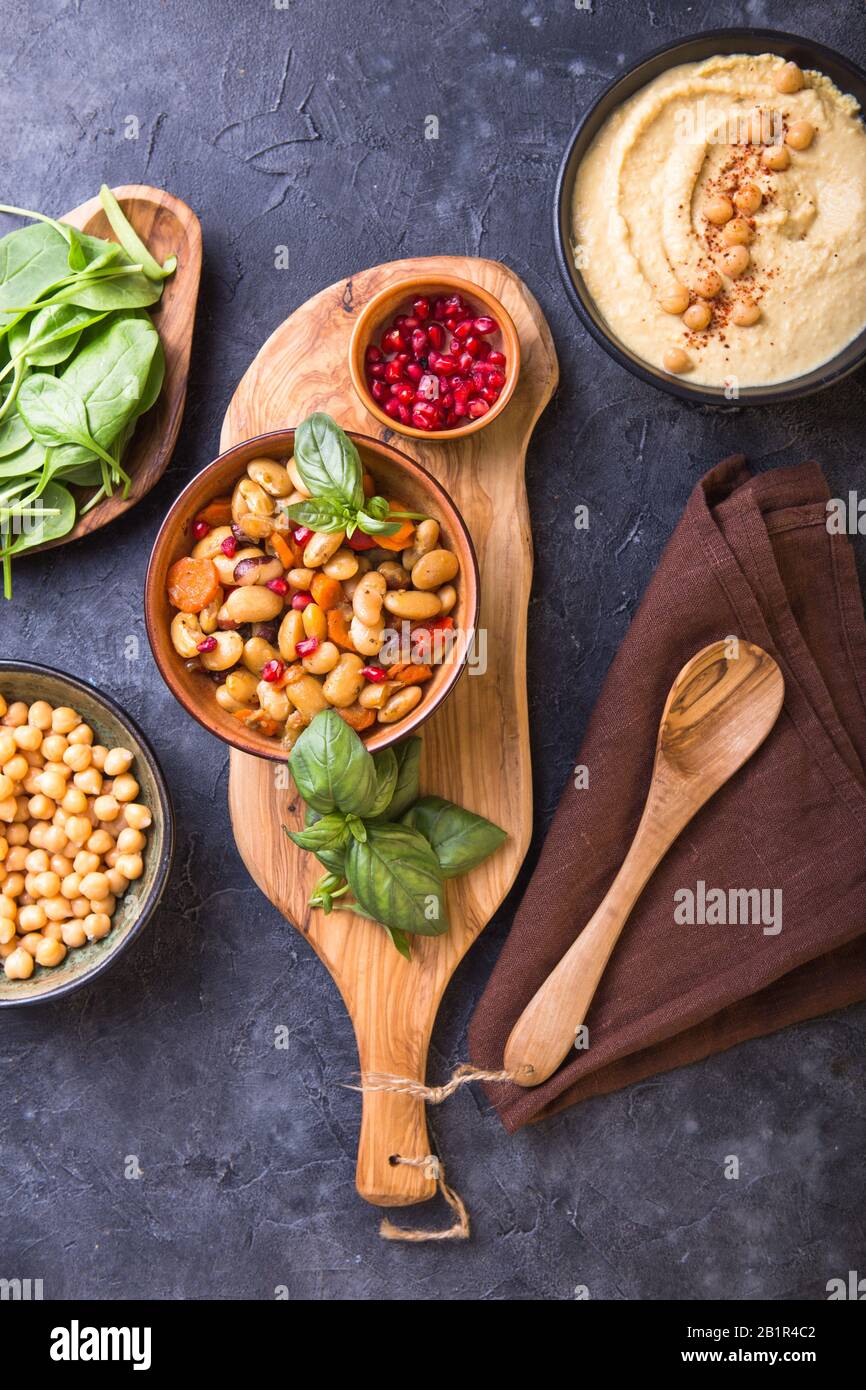 Mediterranean mezze board with hummus, kidney beans, spinach . top view
