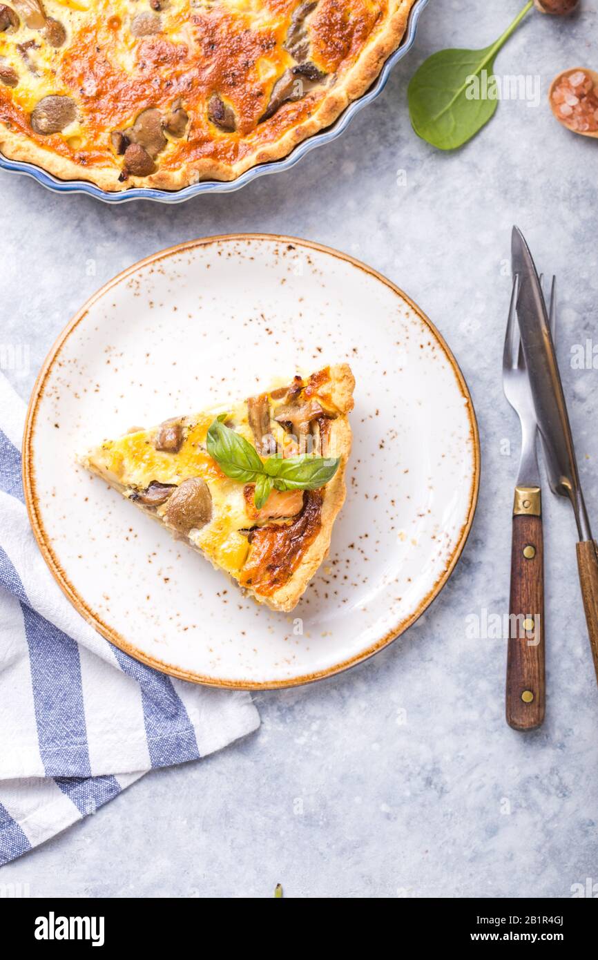 Homemade quiche lorraine with chiken, mushrooms, cheese. top view