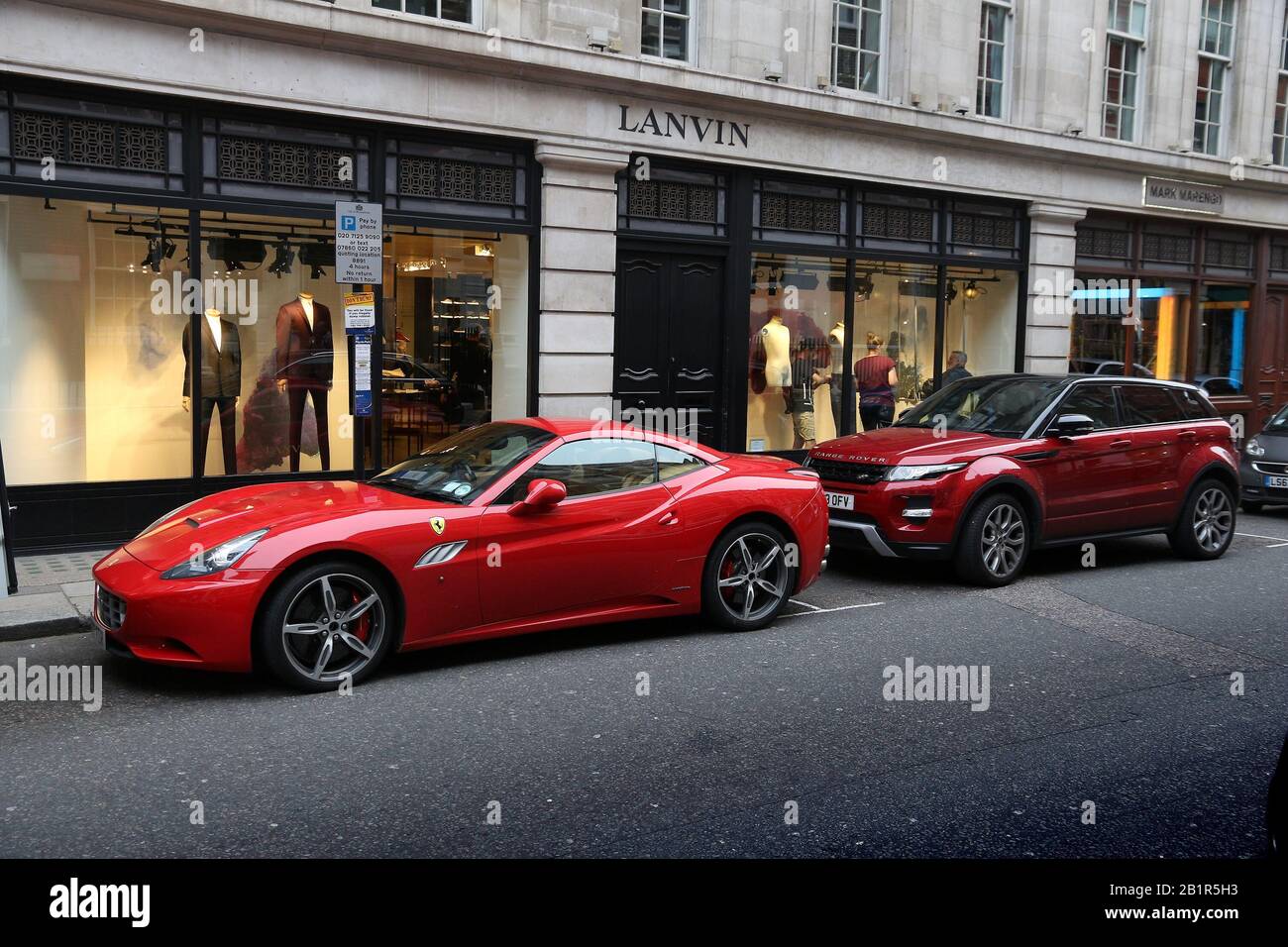 LONDON, UK - JULY 6, 2016: Tailor shops at Savile Row in London. Savile Row is a street in Mayfair, traditionally known for tailors. Stock Photo