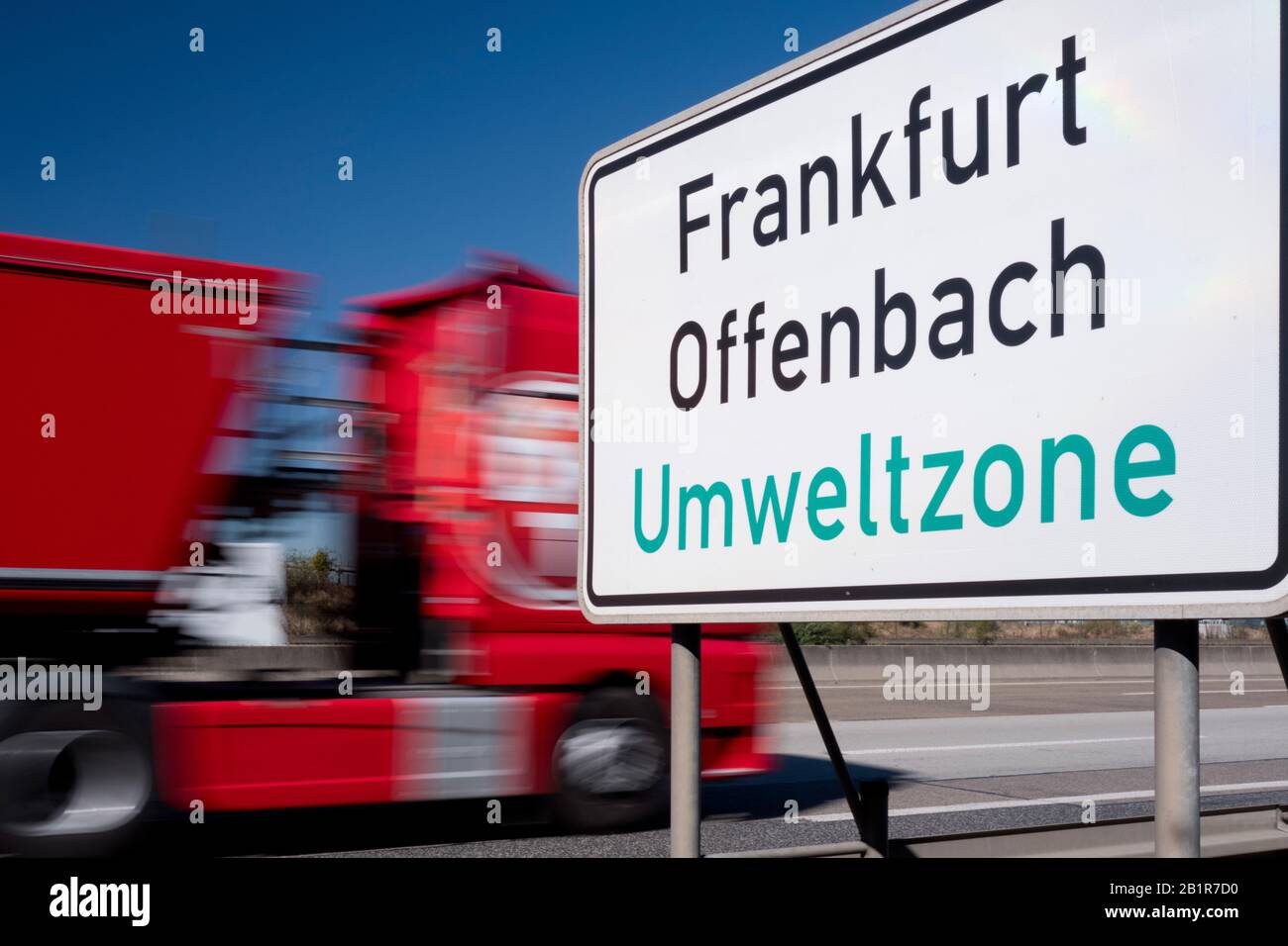 Heavy-duty vehicle next to traffic sign for a low-emission zone on the German Autobahn A5, Germany, Frankfurt Stock Photo