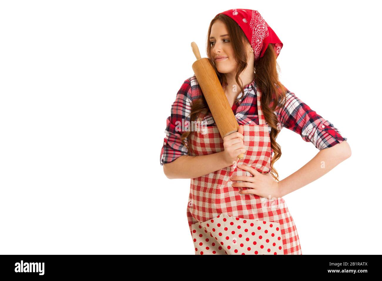 Beautiful young woman holds kitchen roller isolated over white background Stock Photo