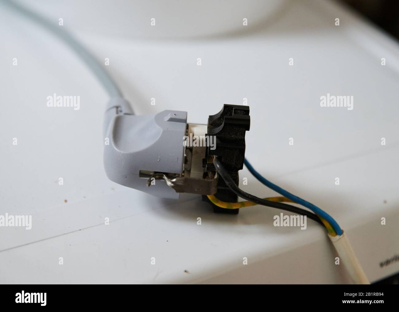 Berlin, Germany. 13th Feb, 2020. A plug is stuck in a broken torn out socket with exposed cables. Credit: Annette Riedl/dpa/Alamy Live News Stock Photo