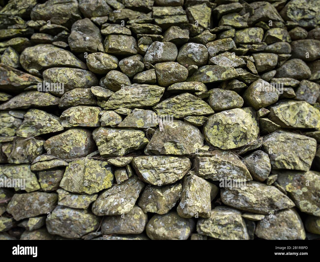 Dry Stone Wall texture. Full frame texture of a traditional British dry stone wall as is typically found in rural Wales and the North of England. Stock Photo