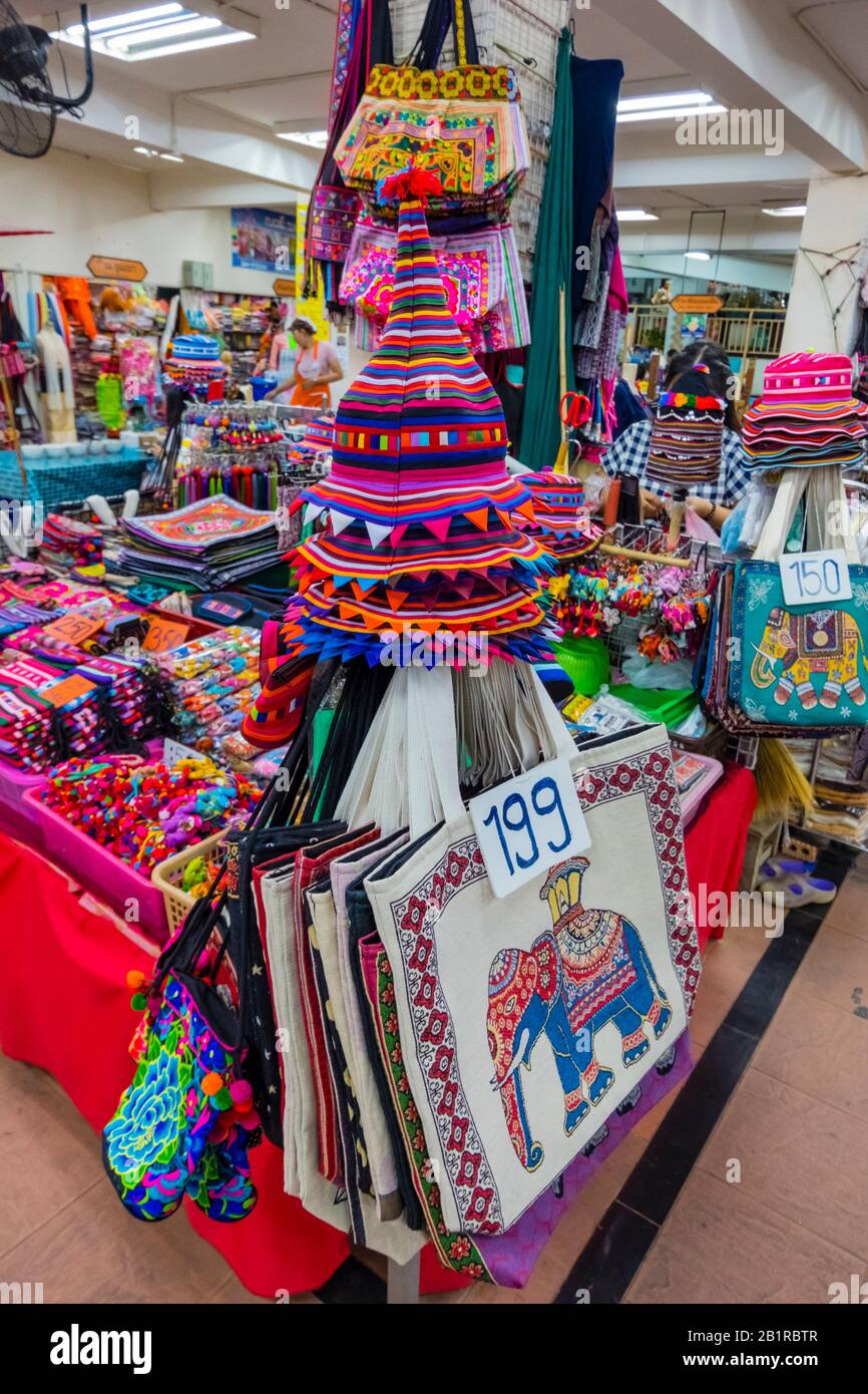 Akha hill tribe huzzah hats and other popular souvenirs, Talat Warorot, market hall, Chiang Mai, Thailand Stock Photo