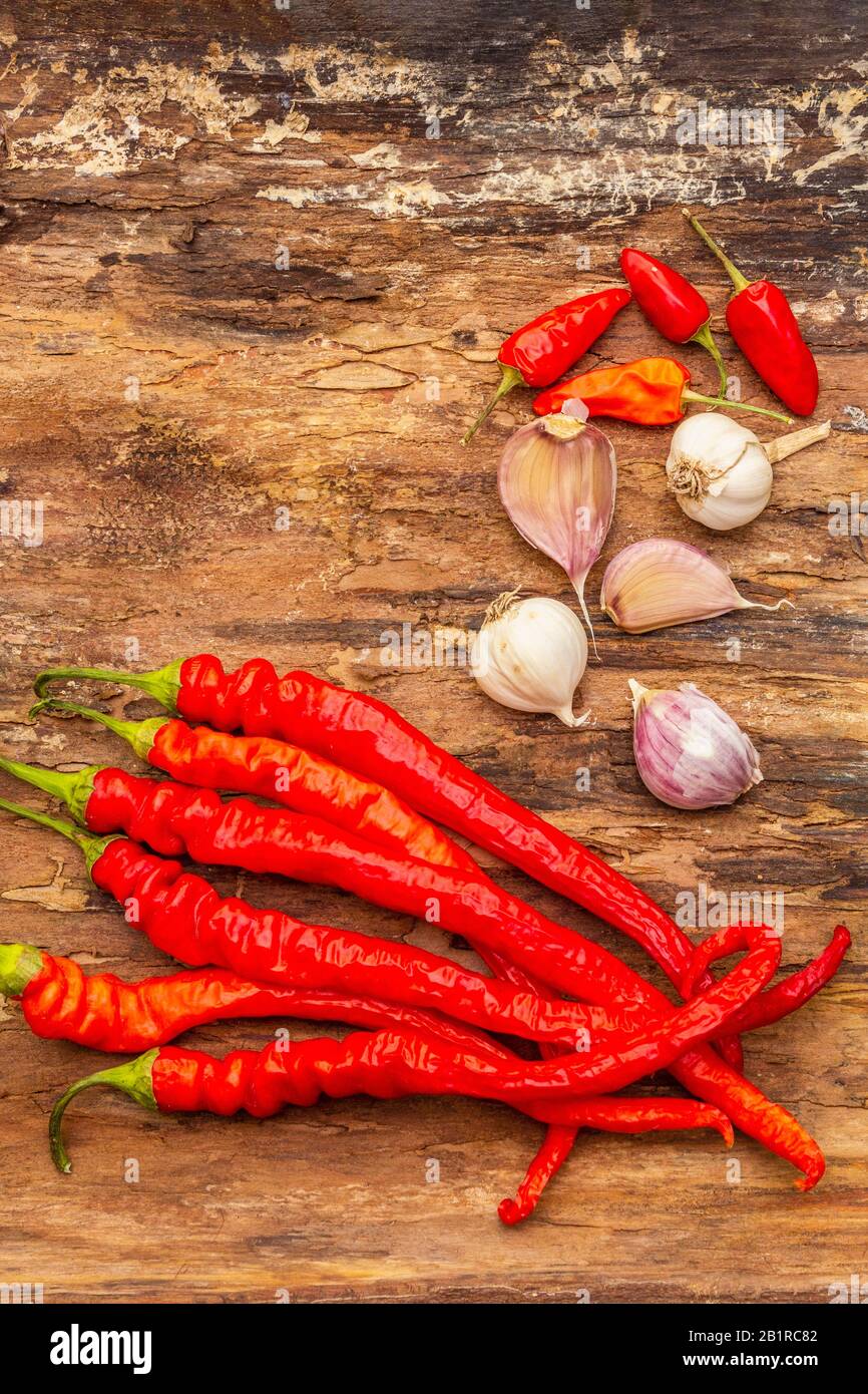 Red and orange chili pepper with garlic cooking food background