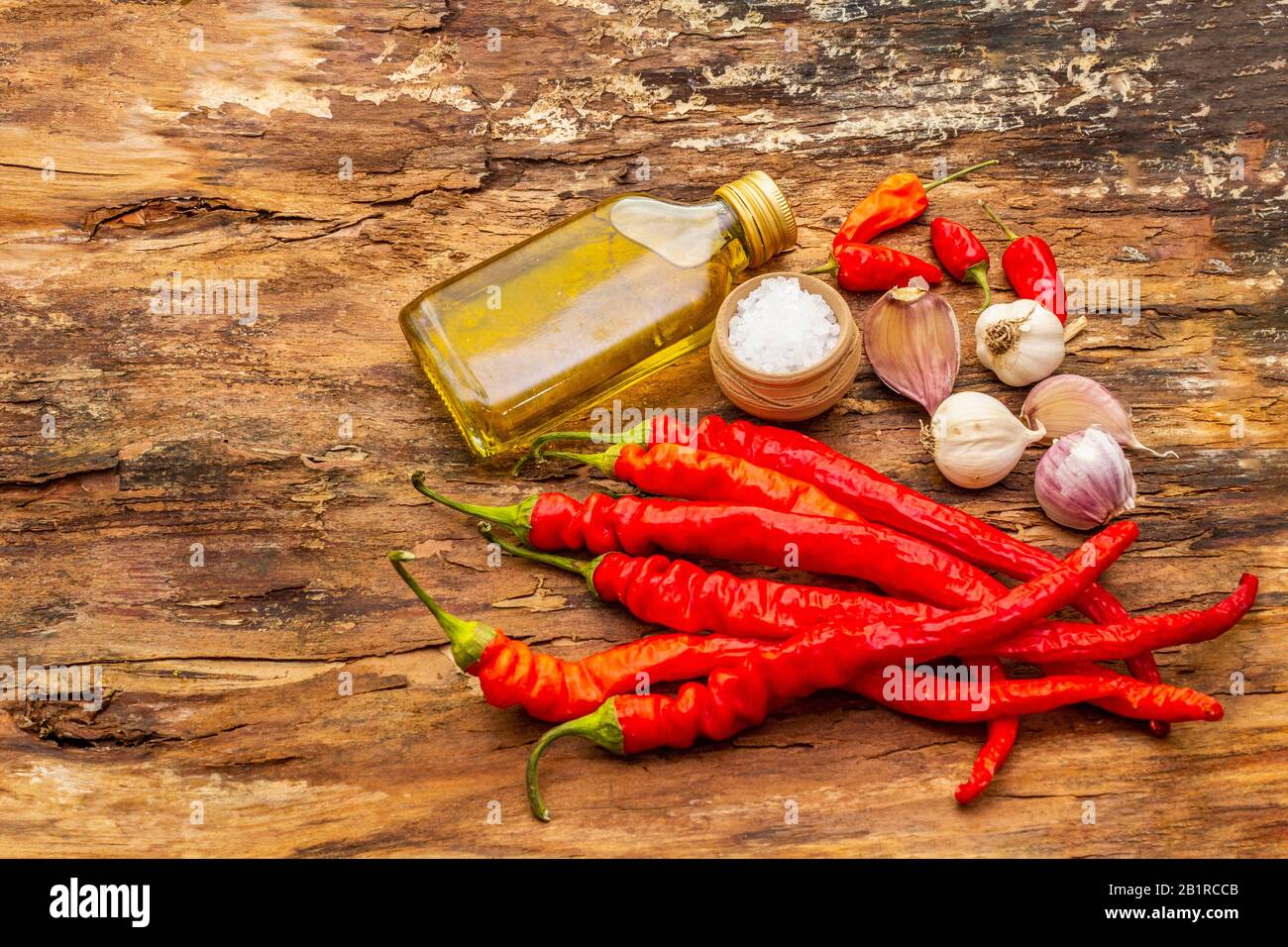 Red and orange chili pepper with garlic cooking food background