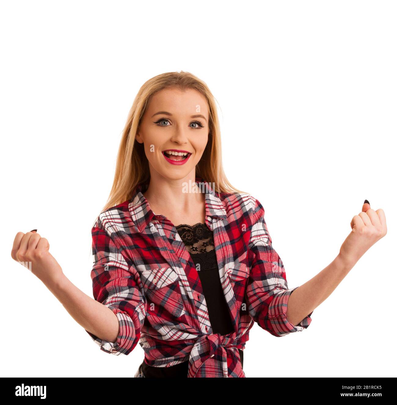 cute young woman in checkered shirt gestures success with arms up isolated over white Stock Photo