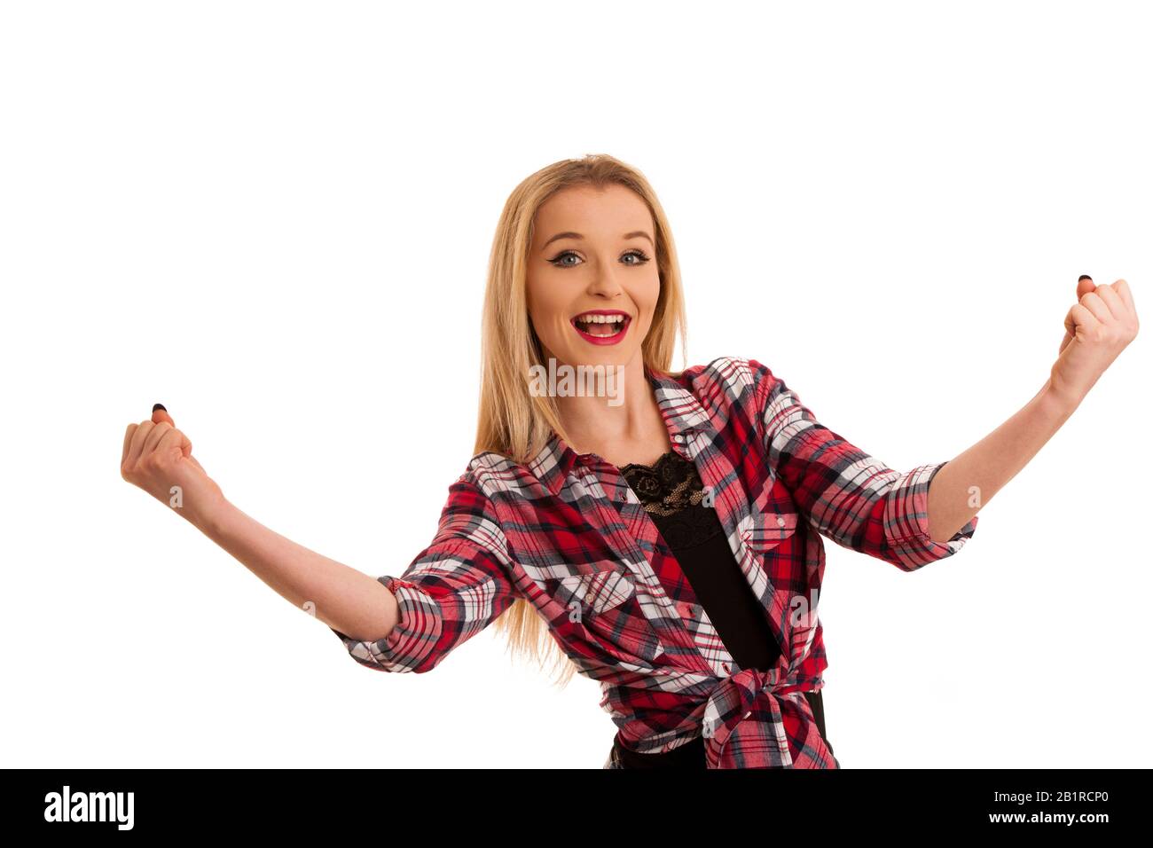 cute young woman in checkered shirt gestures success with arms up isolated over white Stock Photo