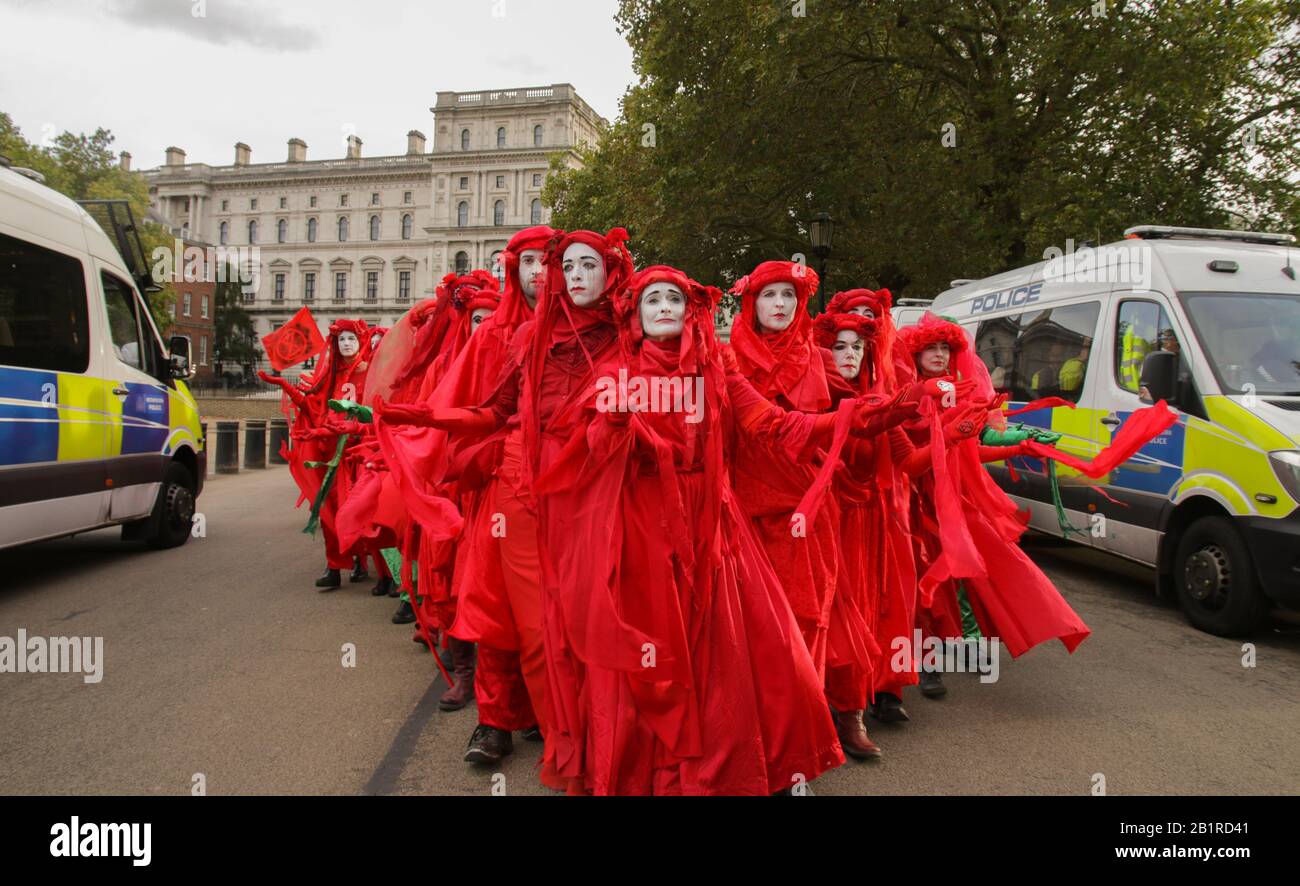 @ptrbrks - 'Come Together'. The Red Rebel Brigade is a performance protest, projecting emotion to interrupt daily life and call for climate action. Stock Photo