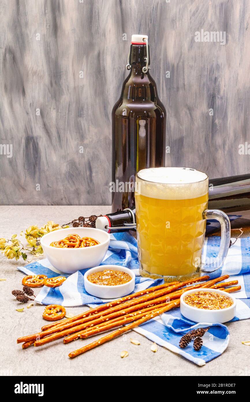 Oktoberfest set. Light beer, pretzels, mustard, sesame straw, hop