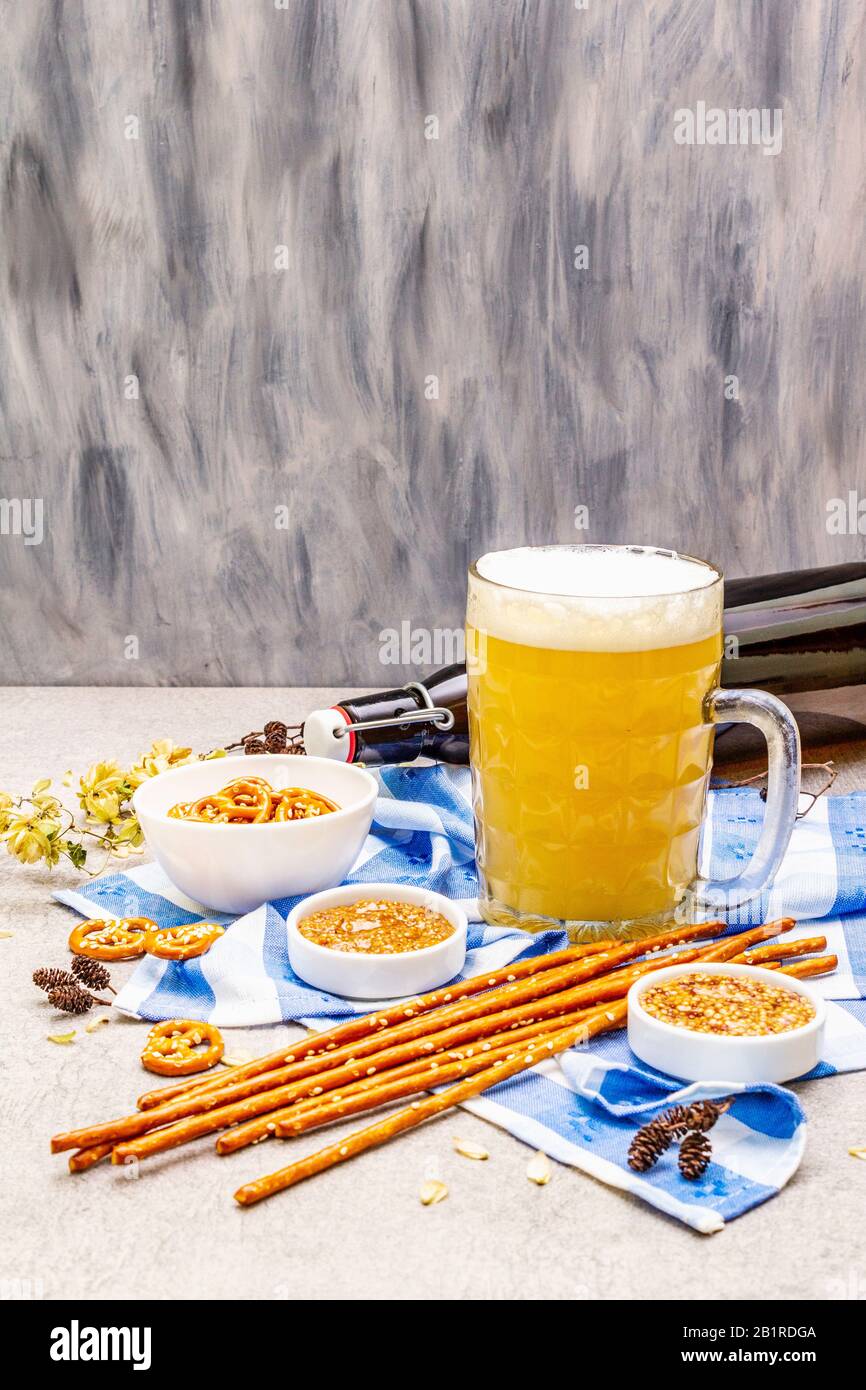 Oktoberfest set. Light beer, pretzels, mustard, sesame straw, hop