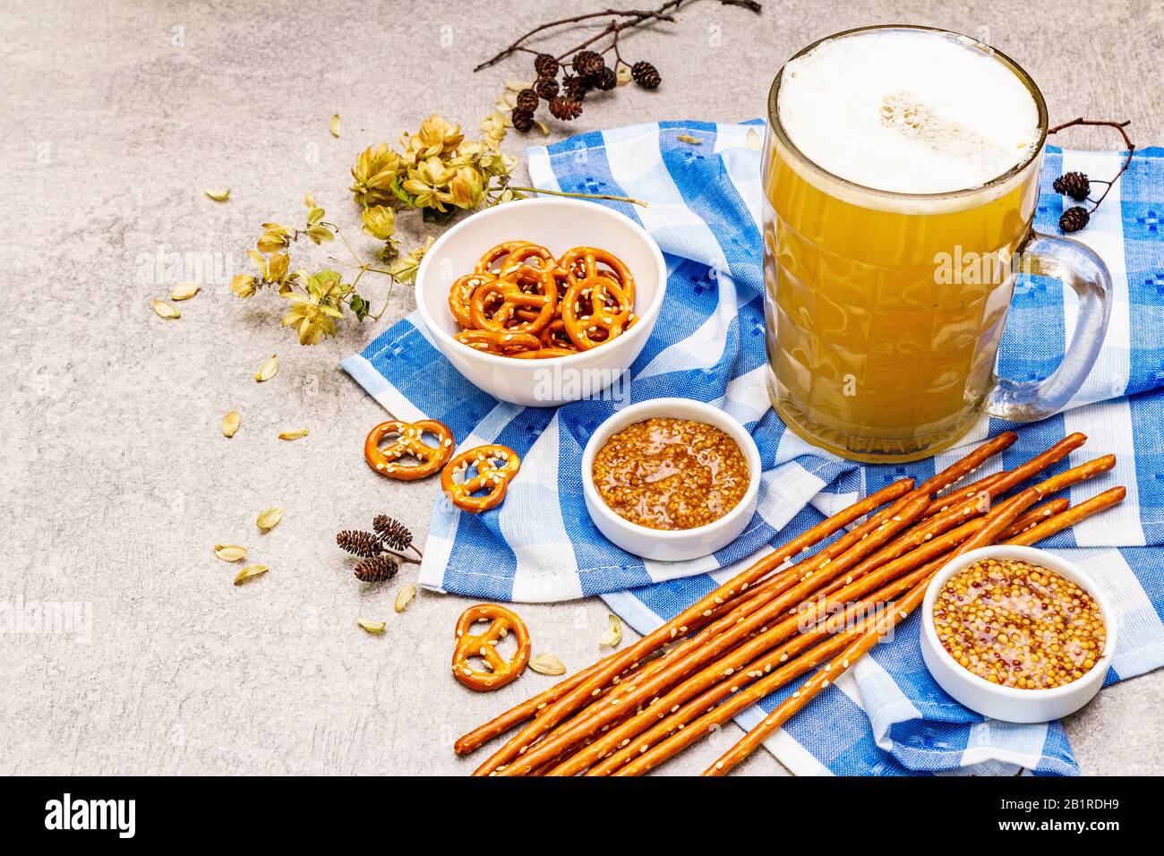 Oktoberfest set. Light beer, pretzels, mustard, sesame straw, hop