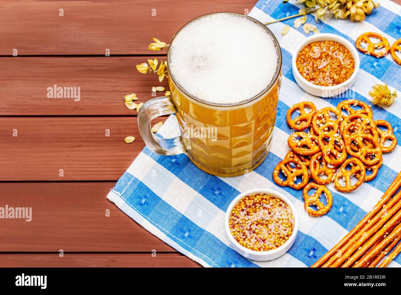 Oktoberfest set. Light beer, pretzels, mustard, sesame straw, hop