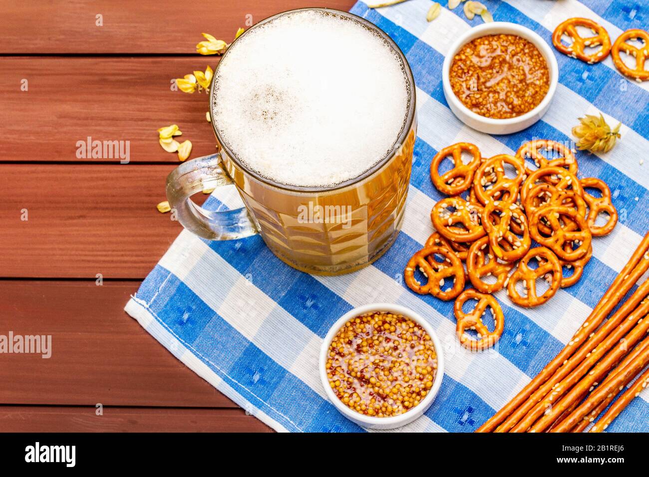 Oktoberfest set. Light beer, pretzels, mustard, sesame straw, hop