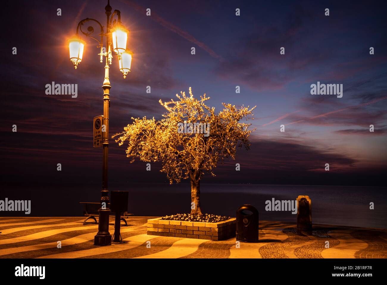 Lazise, Garda lake, Italy after sunset Stock Photo