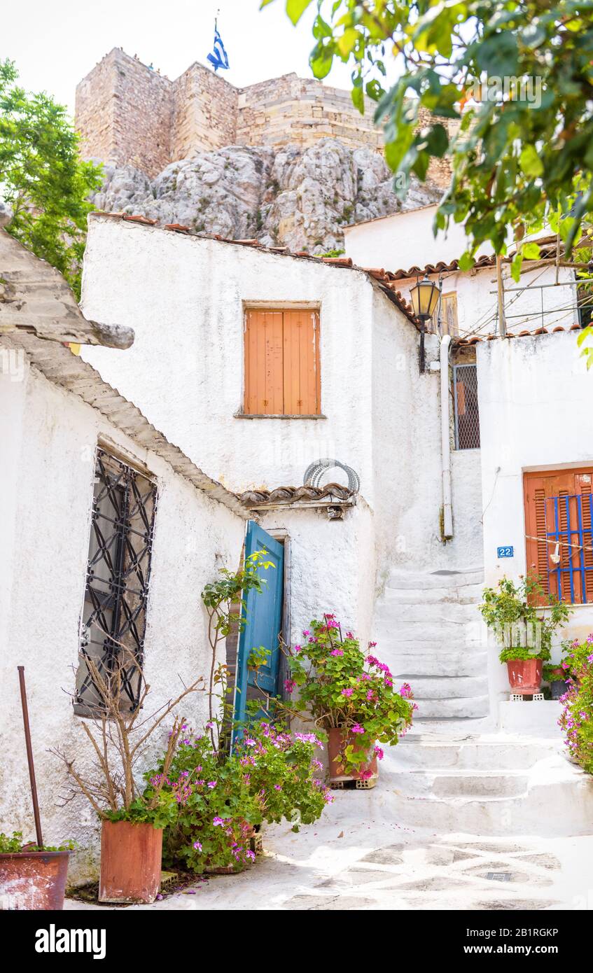 Scenic narrow street with old houses in Anafiotika, Plaka district, Athens, Greece. Plaka is one of the main tourist attractions of Athens. Beautiful Stock Photo