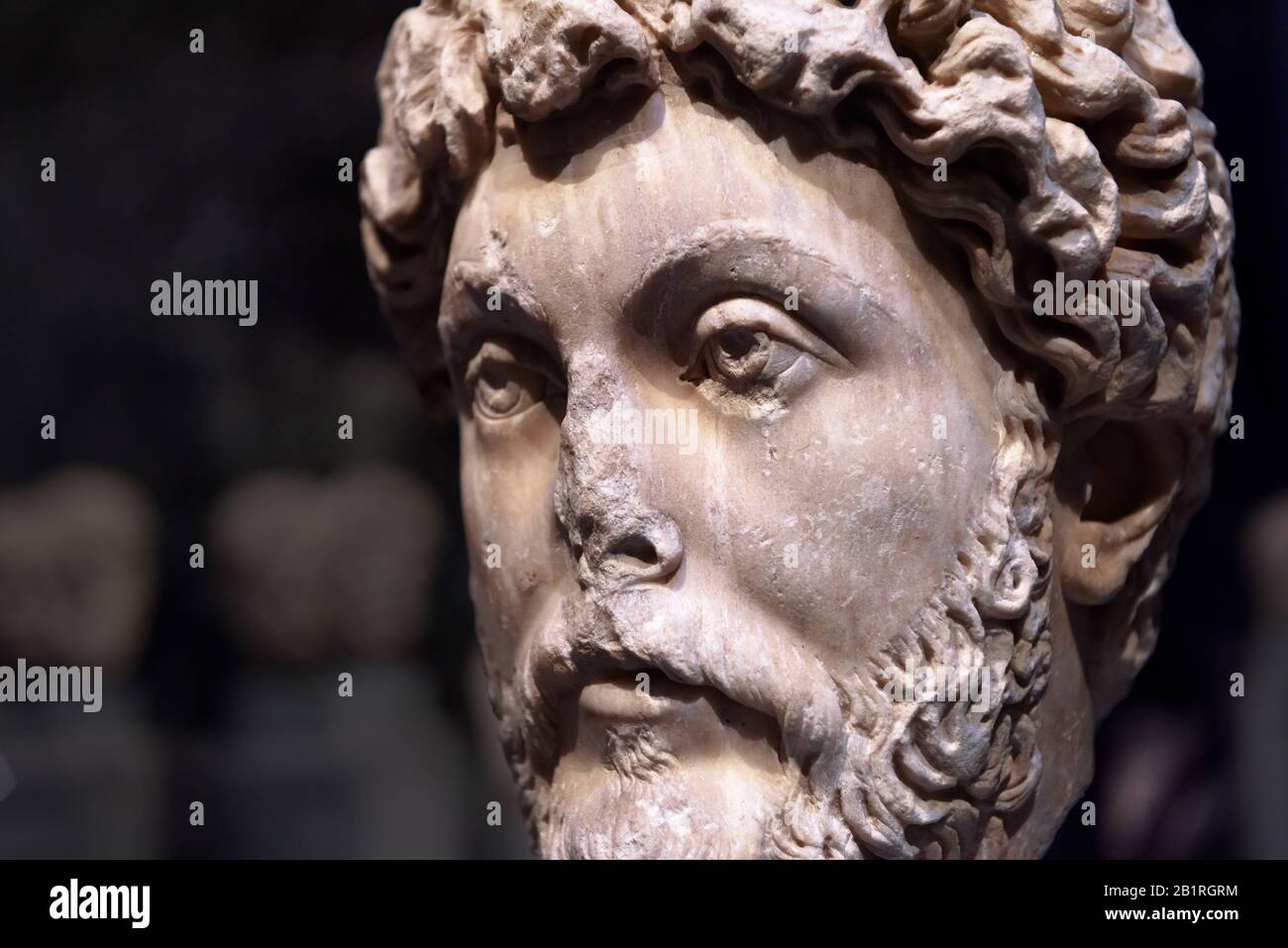 Head of Roman emperor Marcus Aurelius, detail of an ancient marble statue. Classic antique stone sculpture. Caesar Marcus Aurelius, called the Philoso Stock Photo