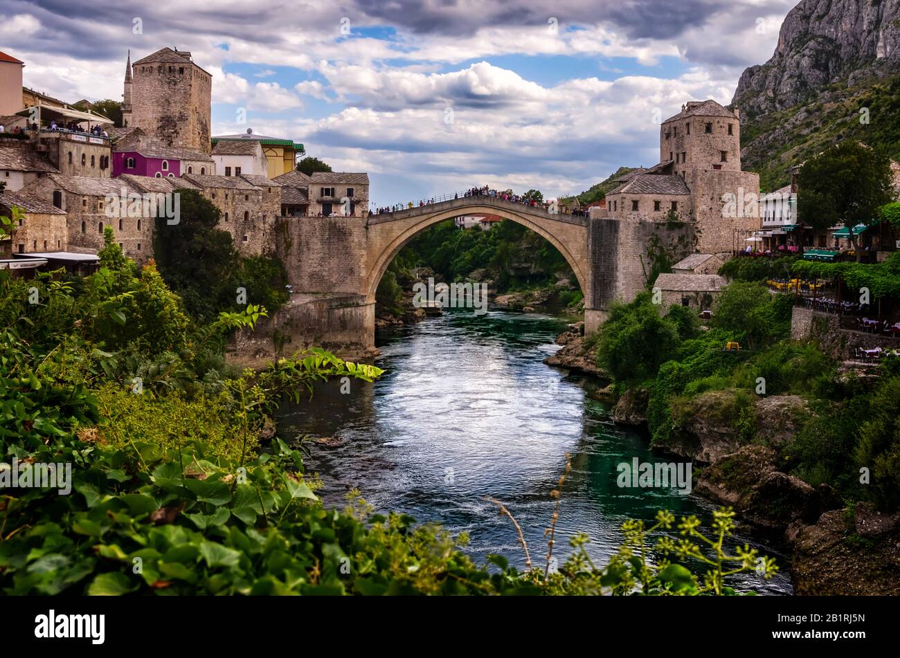 View of the old bridge of Mostar (Stari Most), the Neretva river and ...
