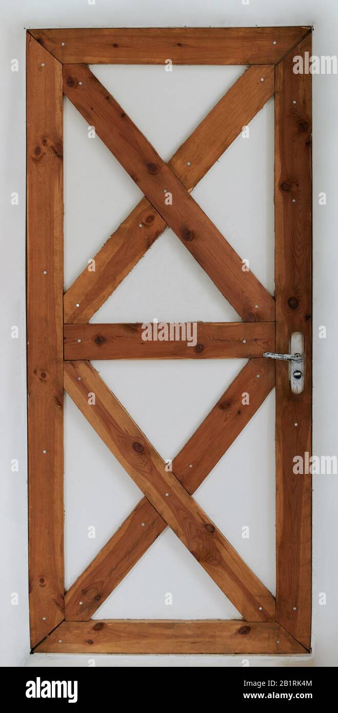Rustic wooden door isolated on white background. Wood door frame Stock Photo