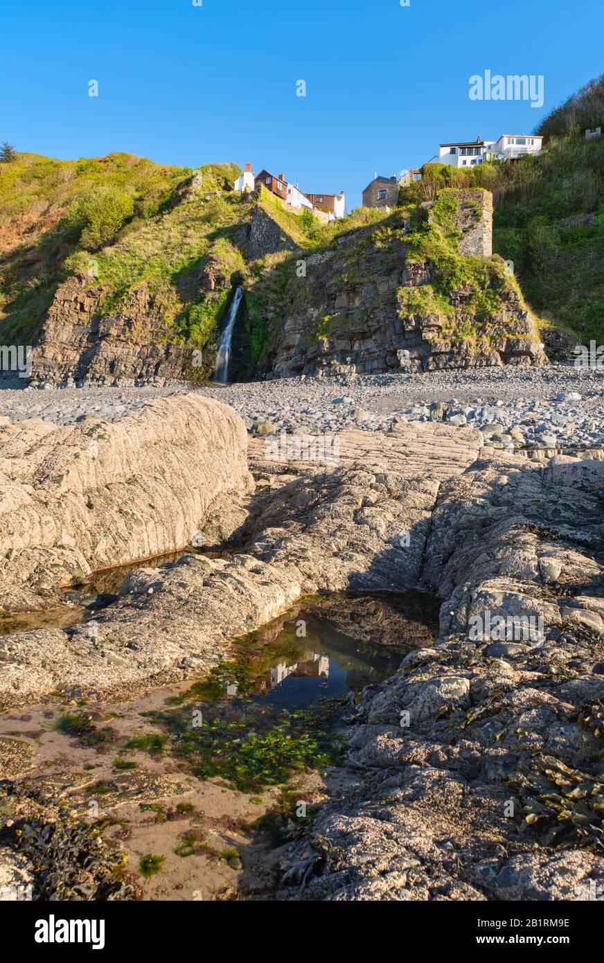 Coastal waterfall on the beach at Bucks Mills at the bottom of the unique, historic village, Geographical feature, coastal life, North Devon, UK Stock Photo