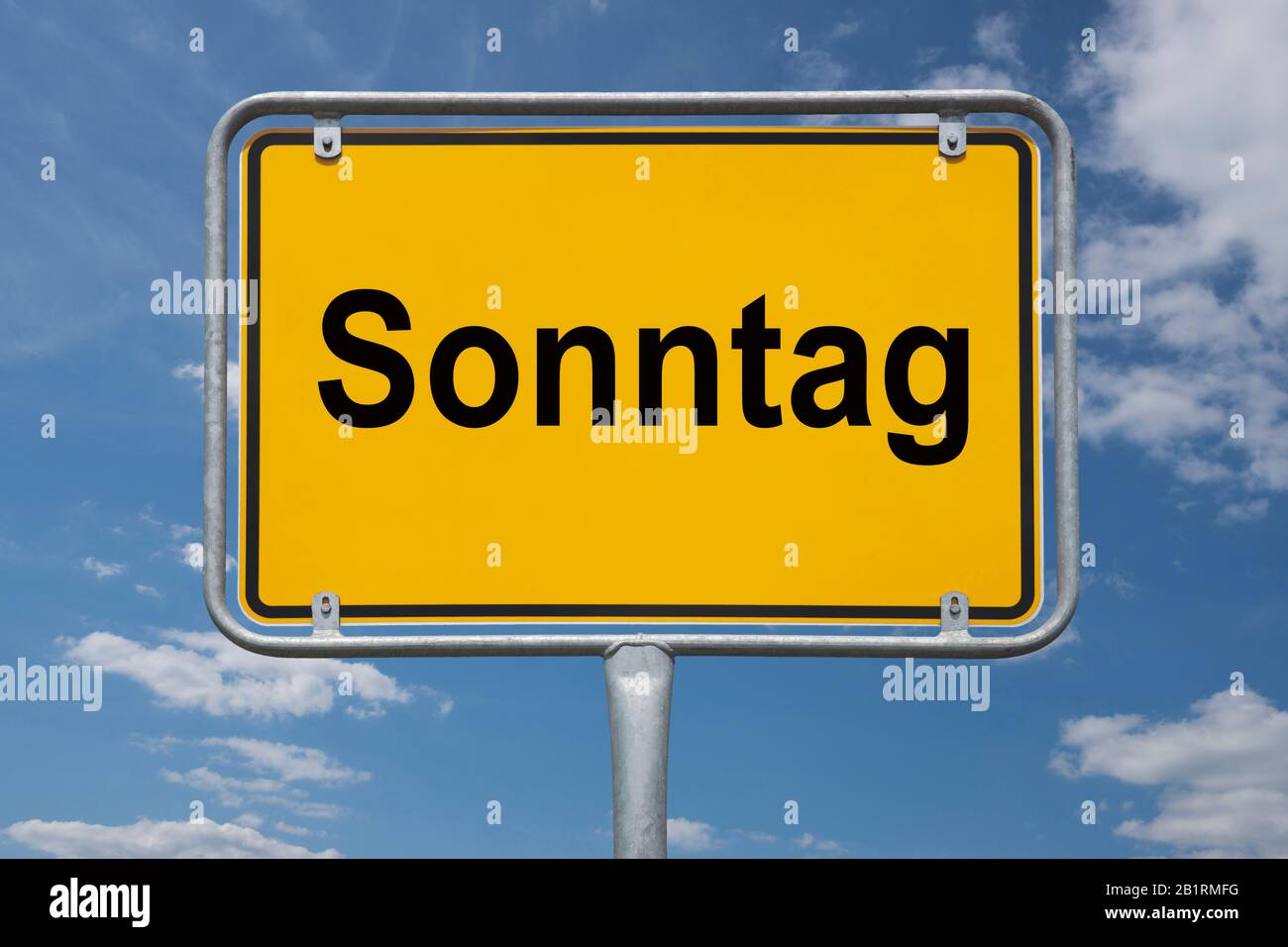 Inscription Sonntag (Sunday) on a traffic sign, place-name sign Germany, beginning of the town Stock Photo