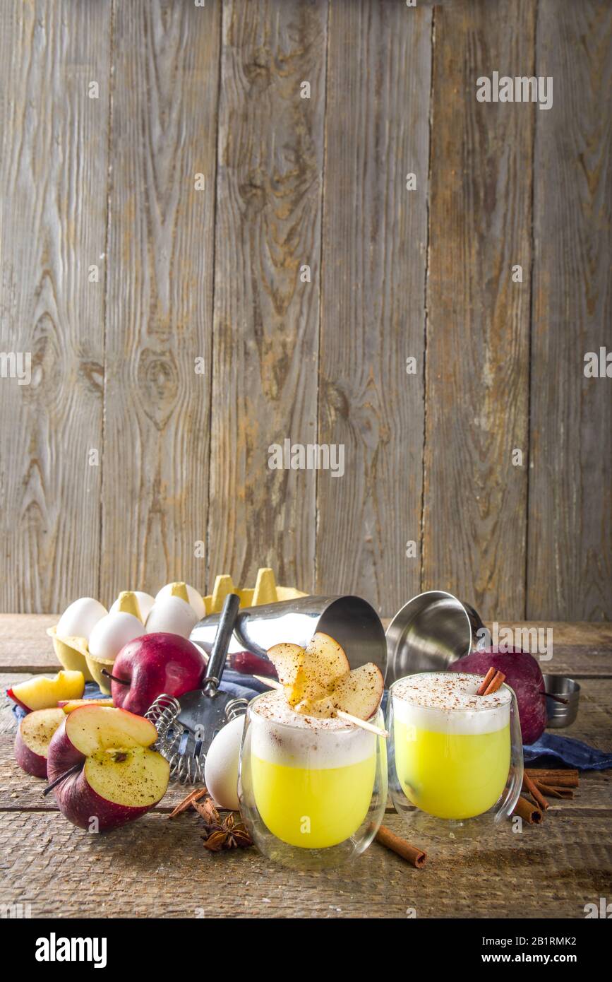 Apple cider sour card cocktail. Autumn Egg Flip alcohol beverage in shot glasses Stock Photo