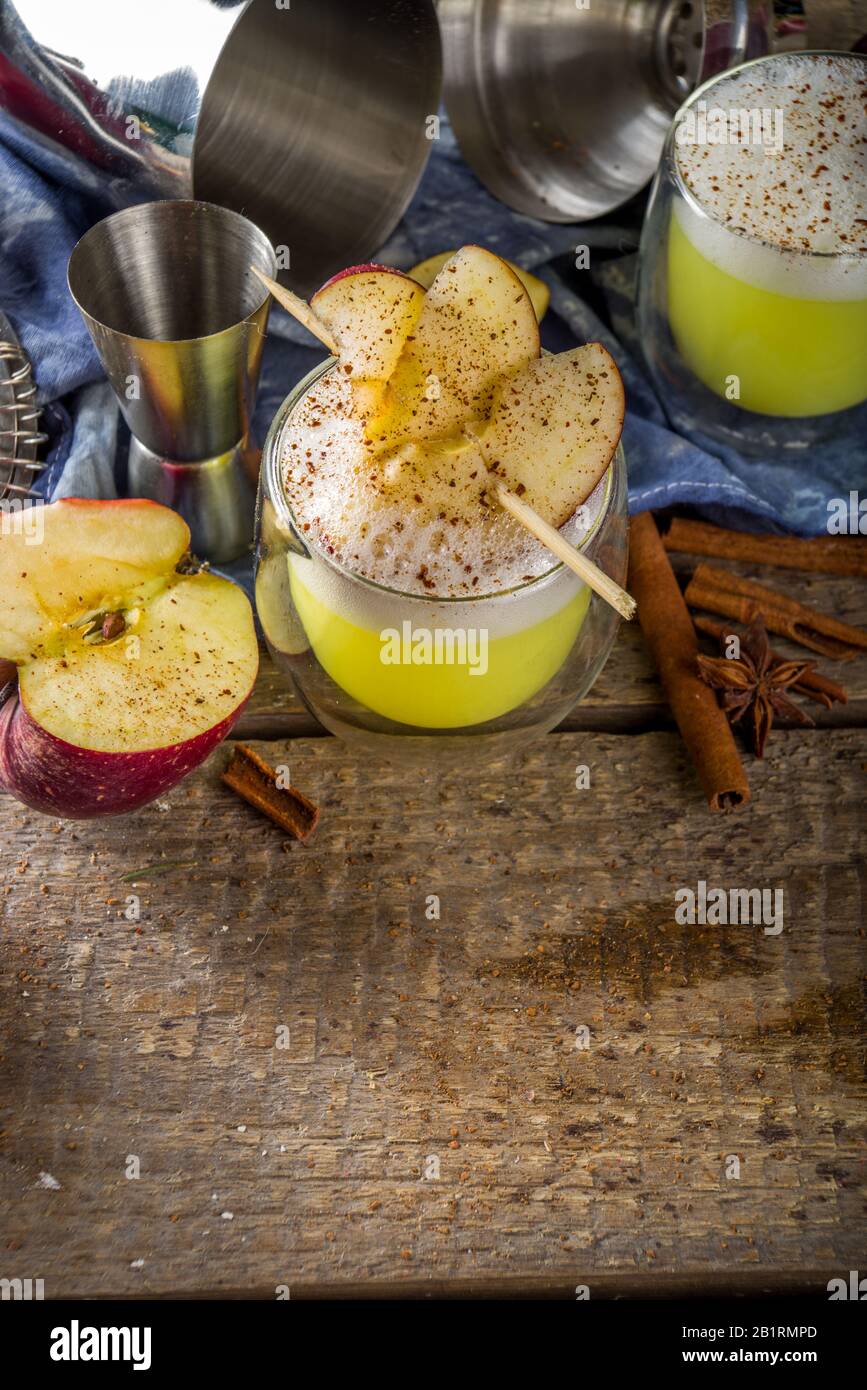 Apple cider sour card cocktail. Autumn Egg Flip alcohol beverage in shot glasses Stock Photo